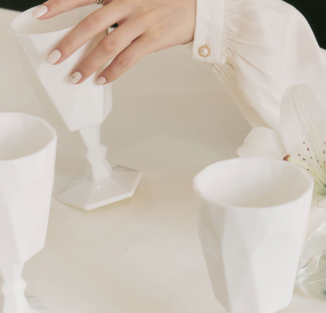 Elegance Reimagined: The White Jade Wine Glass Sculpture"